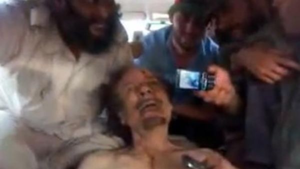 A video still apparently showing Qaddafi's corpse