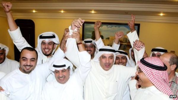 Liberals, who were not represented in the previous parliament, won three seats in the elections. Here, they celebrate in Kuwait City on Sunday morning. (AFP)