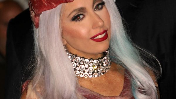 Dressed for the media sharks: Lady Gaga wears meat for MTV music. Gaddafi also always dressed for the kill.