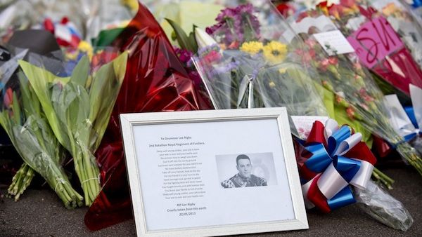 A framed photograph of Drummer Lee Rigby lies among flowers and tributes in Woolwich. AFP Photo