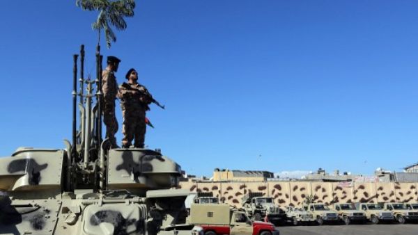 Members and vehicles of the Al-Qaaqa brigade from Zintan get ready to vacate the premises of their Tripoli quarter on November 21, 2013, as part of a government decision to remove militias from the capital. Libya's international allies on Sunday pledged to bring stability to the country. (AFP)
