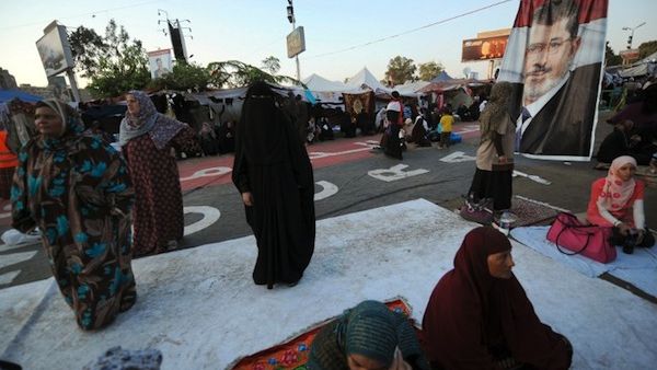 Egyptian female supporters of Egypt's deposed president Mohamed Morsi are seen during their ongoing sit-in protest outside Rabaa al-Adawiya mosque in Cairo on July 31, 2013. (AFP)
