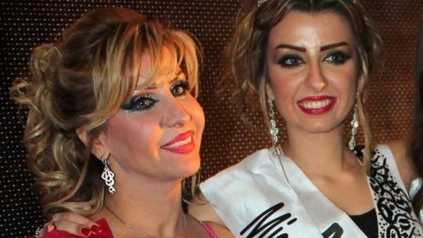 Nadine Fahad (R) is crowned queen.
