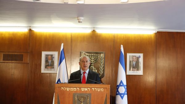 Israel's Prime Minister Benjamin Netanyahu delivers a statement to the media at the Knesset, in Jerusalem (AFP/BAZ RATNER/POOL)