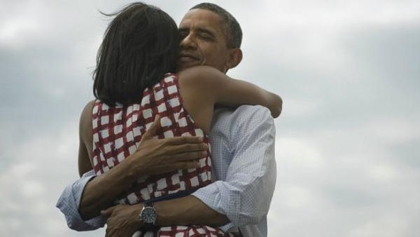 President Obama hugs his wife Michelle 