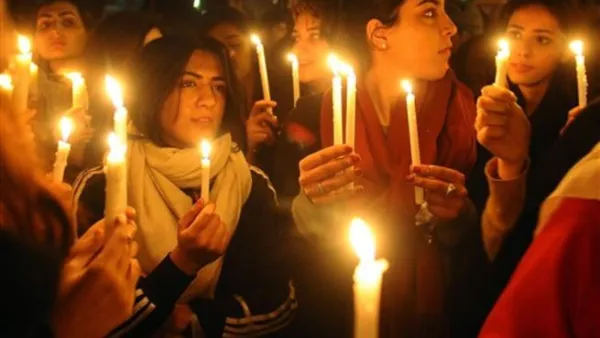 Pakistani civil society activists hold lit candles as they march in tribute to slain governor Punjab province Salman Taseer during a rally in Lahore on January 7, 2011. 