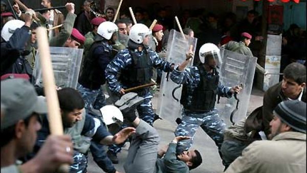Palestinian police fight protesters in Ramallah. (AFP/File) Palestinian police fight protesters in Ramallah. (AFP/File)