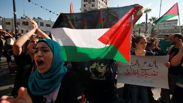 Protesters shout slogans during a demonstration against the Israeli government on July 15, 2013 near the West Bank town of Ramallah. (AFP)