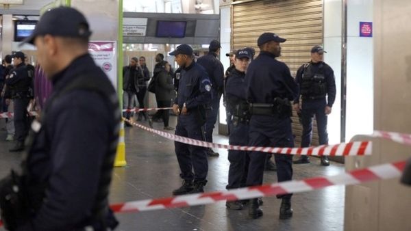 Police officers gather at the site of the stabbing, in Paris. AFP Image. 