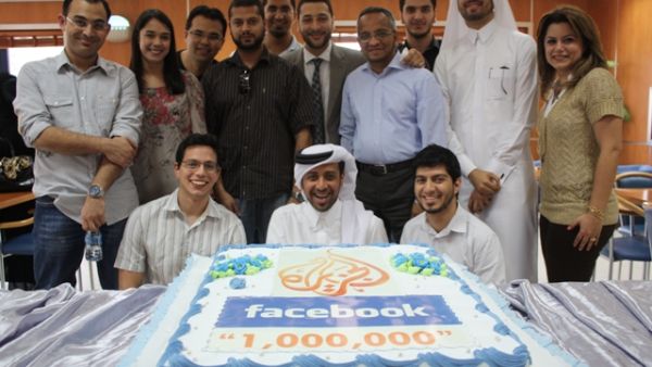 Al Jazeera's social media team celebrating with a specially branded cake