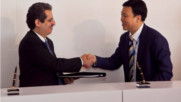 Dr. Nasser Marafih, CEO, Qtel Group, exchanges the agreement with Shi Lirong, CEO, ZTE Corporation. Dr. Nasser Marafih, CEO, Qtel Group, exchanges the agreement with Shi Lirong, CEO, ZTE Corporation.