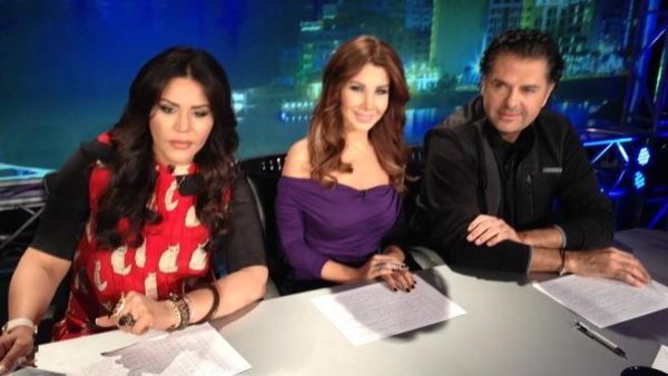 Ragheb (R) sits with Ahlam (L) and Nancy backstage