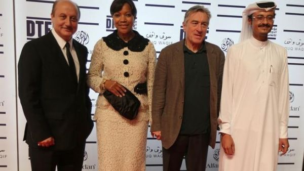 US actor Robert De Niro (2nd L) founder of New York's Tribeca Film Festival, poses for a photograph along side his wife Grace Hightower De Niro and Indian actor Anupam Kher (L) and Doha Film Institute CEO Abdulaziz Bin Khalid Al-Khater (R) at the Doha Tribeca Film Festival in the Qatari capital. AFP