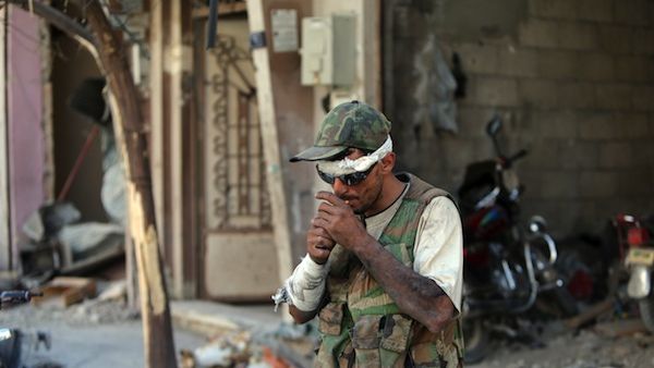 One Iranian Revolutionary Guard commander has criticised the "bad habits" of the Syrian army, who he says prefer smoking and drinking tea to fighting. (AFP/File)