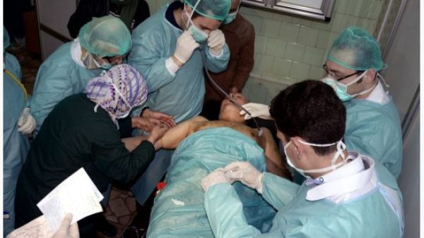A victim who suffered an alleged chemical attack at Khan al-Assal village receives treatment by doctors, at a hospital in Aleppo in March. AFP Photo