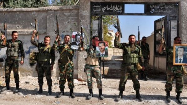 The United Nations on Monday announced that the Geneva II Syria peace conference - which aims to bring together the government and opposition - is set to be held on January 22, 2014. In this handout picture released by the official Syrian Arab News Agency (SANA) on November 15, 2013, soldiers loyal to the regime posing with their weapons. (AFP)
