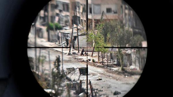 Syrian snipers, when bored, shoot at pregnant women and civilians as a game, a UK doctor said (AFP/File)