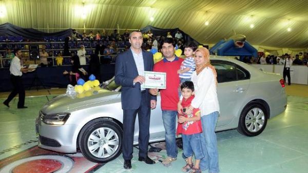 The winner with his family receiving the prize from Khalid Zebib The winner with his family receiving the prize from Khalid Zebib