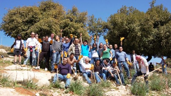 Employees of Four Seasons Hotel Amman planting trees Employees of Four Seasons Hotel Amman planting trees