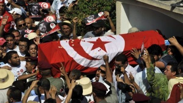 Tunisian mourners carry the coffin of assassinated opposition leader Mohamed Brahmi on Saturday. (AFP)