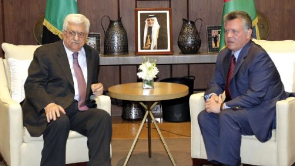 Jordan’s King Abdullah II (R) and Palestinian President Mahmoud Abbas (R) signed an agreement confirming their “common goal to defending” Jerusalem. (AFP)
