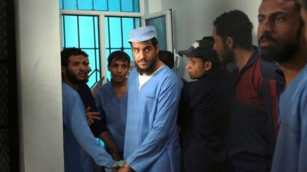 Suspects from al-Qaeda wait for their trial Sunday in Sanaa (Mohammed Huwais/AFP)