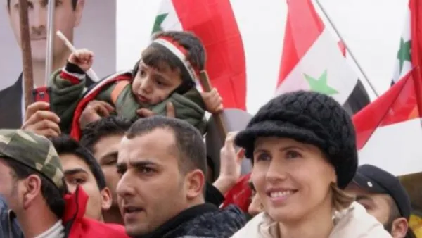 السيدة السورية الاولى اسماء الاسد تستمع الى كلمة زوجها الرئيس السوري بشار الاسد في دمشق الاربعاء
