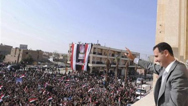 Syrian President Bashar Assad waves to his supporters before the civil war hit the level of brutality it is at currently. AFP Photo
