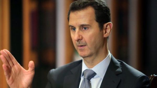 Bashar al-Assad supported peace talks after a meeting with Russian Deputy Foreign Minister Mikhail Bogdanov. (AFP/Joseph Eid)