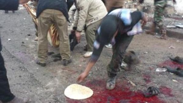 اثار الدماء في موقع غارة جوية سورية على مخبز في بلدة حلفايا قرب حماة