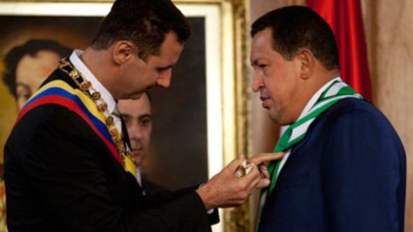 الاسد والرئيس الفنزويلي هوغو شافيز
