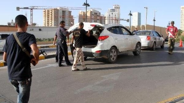Local militias have set up their own checkpoints throughout the country as a way to maintain power over territory since the oust of Gaddafi in 2011 (File Archive/AFP)