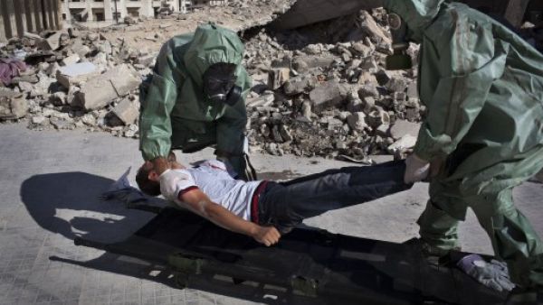 Volunteers take part in a simulation of how to respond to a chemical attack, in the northern Syrian city of Aleppo on September 15, 2013. Saudi Arabia on Tuesday said the use of chemical agents should not be allowed to 'minimise' the Syrian crisis. (AFP)
