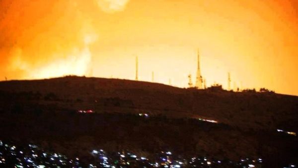 Damascus sky lights up following the heavy blasts that shook the capital early Sunday. (Al Arabiya)