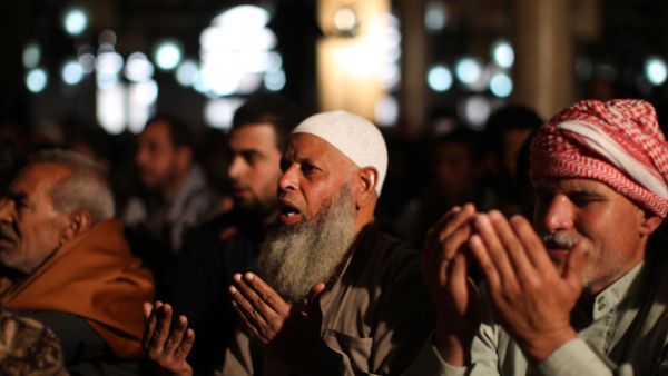 18 Saudi preachers have been detained for mentioning Egypt and Syria in their sermons. Egyptian men attend weekly Friday prayers at Al-Azhar Mosque in Cairo. [AFP]