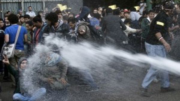 Egyptian security officials used water cannons and teargas to disperse two protests in Cairo Tuesday (Khaled Desouki/AFP)