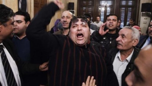 An unidentified Egyptian man shouts slogans against Egypt's President Mohamed Morsi and in support of an election boycott during a meeting of leaders from the Egyptian National Salvation Front (NSF) in Cairo in February. (Photo:  AFP / Gianluigi Guercia)