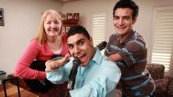 Emanuel Kelly and brother with their Australian adoptive family.  Emmanuel and his brother suffer from limb deficiencies.