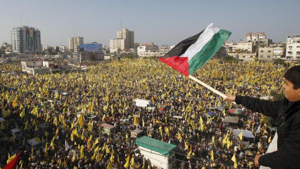Fatah and Hamas supporters rally in Gaza on January 4, 2012. (AFP Photo)