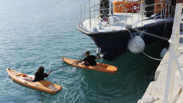 Canadian activists using Kayaks to prevent arrest or raid of their flotilla by the Greek coastal authorities (to no avail but a courageous effort). Photo courtesy of 'Desert Peace'.