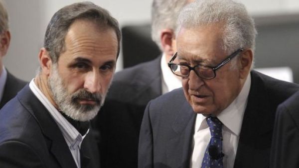Lakhdar Brahimi with Syrian opposition leader Moaz Al-Khatib at the Arab League Doha summit in March