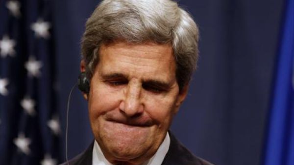 US Secretary of State John Kerry grimaces during a press conference in Geneva on September 14, 2013 after holding talks with his Russian counterpart on Syria's chemical weapons. Washington and Moscow have agreed a deal to eliminate Syria's chemical weapons, Kerry said after talks with Russian Foreign Minister Sergei Lavrov. Kerry said Sunday that the US is still prepared to use force against Syria if diplomacy fails. (AFP)