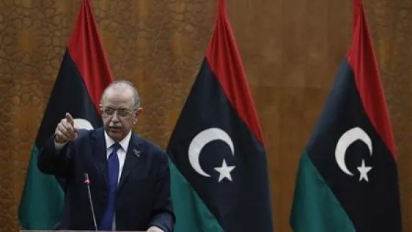 رئيس الوزراء الليبي عبدالرحيم الكيب خلال مؤتمر صحفي في طرابلس
