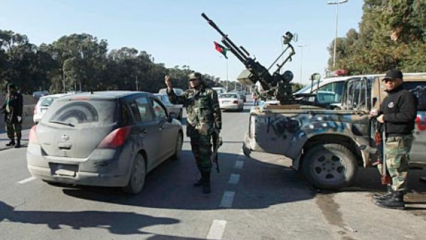 Clashes between Misrata brigade members and security officials at a Tripoli checkpoint left two wounded Tuesday (Ismail Zitouny/Reuters)