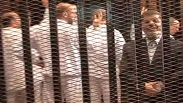 Former president Mohammed Morsi was reportedly "feisty, speaking loudly to the judges and [proclaiming] that he was still the president of Egypt" during Monday's trial (AP)