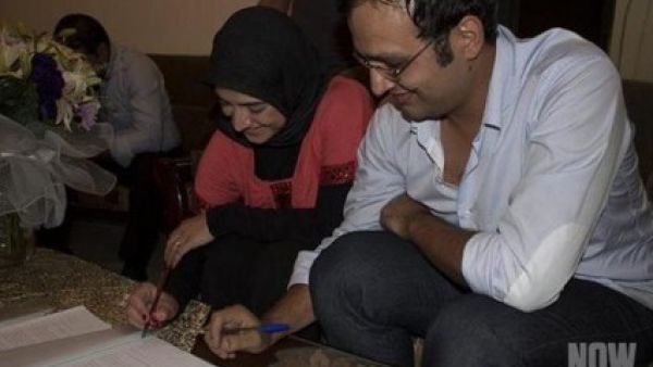Although several Lebanese sheiks have labeled them infidels, these two call see themselves simply as happy and hitched.