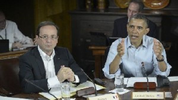 US President Barack Obama (R) and French President Francois Hollande attend a G8 session on May 19, 2012 in Maryland (AFP/File)