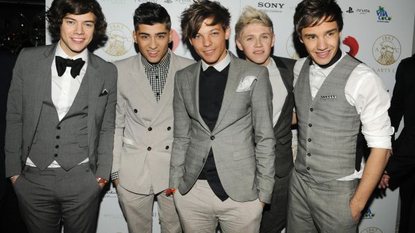 One Direction are reportedly trying to improve their language skills to avoid feeling "embarrassed" abroad 