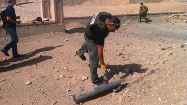 Man inspects a rocket that landed in Israel (used for illustrative purposes)