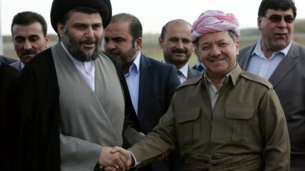 البرزاني يستقبل الصدر في مطار اربيل  
